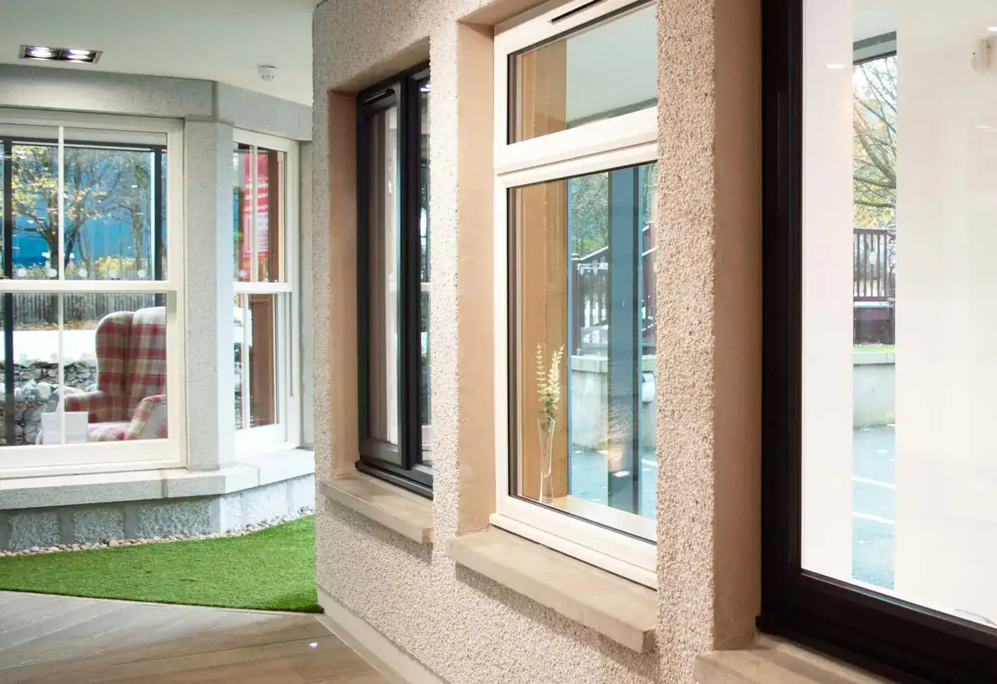 uPVC window showroom in Aberdeen, Scotland, showing white and anthracite framed double-glazed windows in a modern display setting.